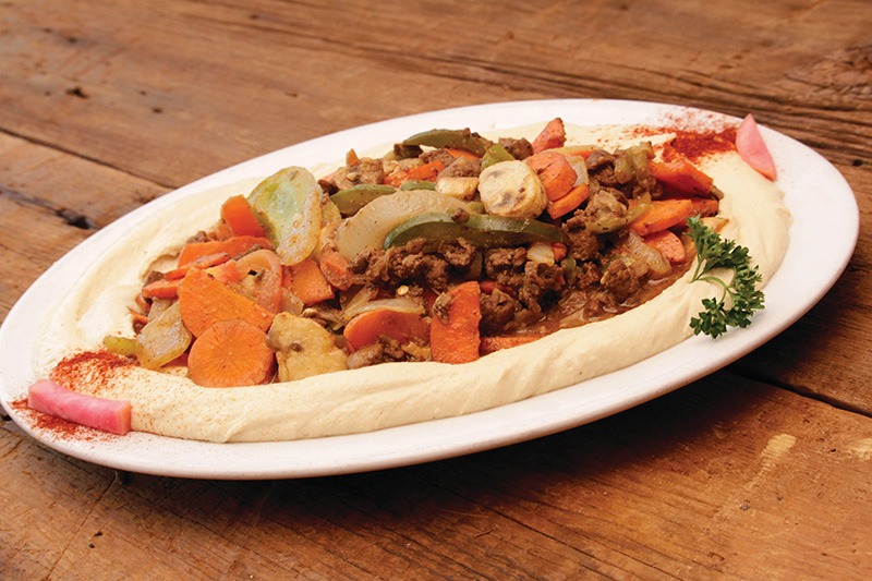 La Marsa Mediterranean sautéed meat ghallaba served on a bed of hommous in South Lyon, MI